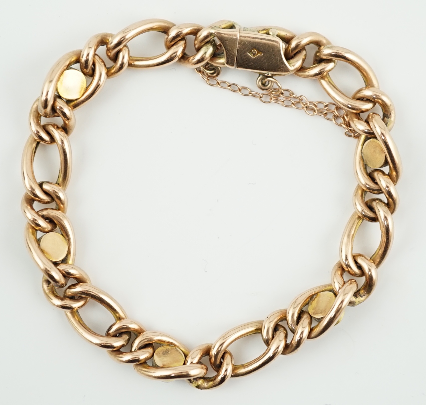 An Edwardian 9ct gold and split pearl set curb link bracelet